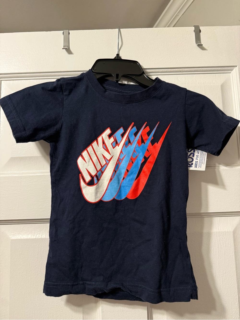 Nike Kids Navy Short Sleeve Tee with Red, Blue & White Swoosh Graphic. Size 6